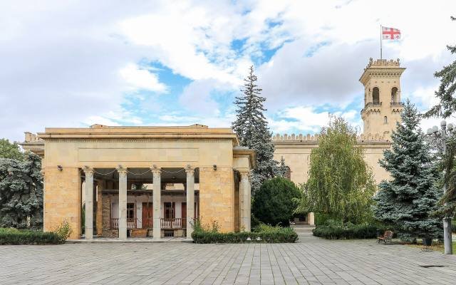 The colonnaded pavilion over Stalin’s birth house, with the tower of the Stalin Museum behind