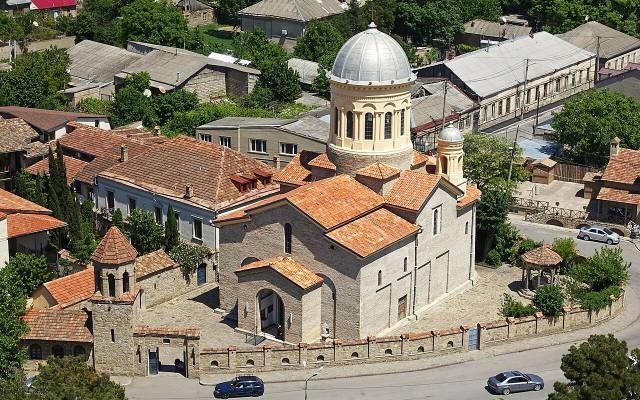 The red-roofed Gori Cathedral among the houses of the city, seen from above